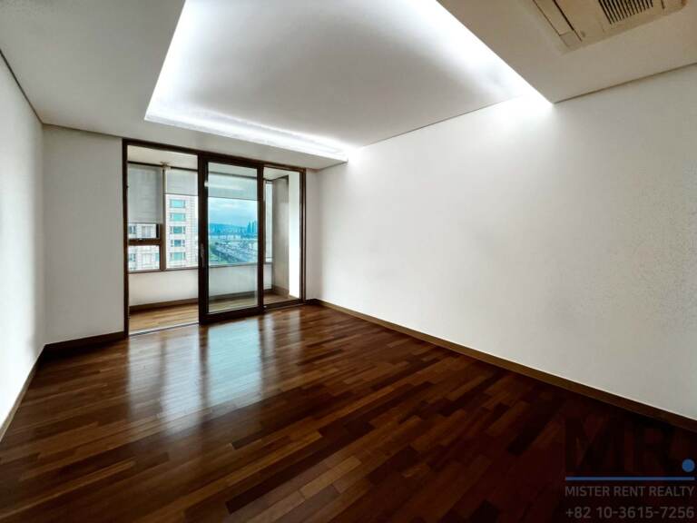 Master bedroom with balcony doors and recessed lighting