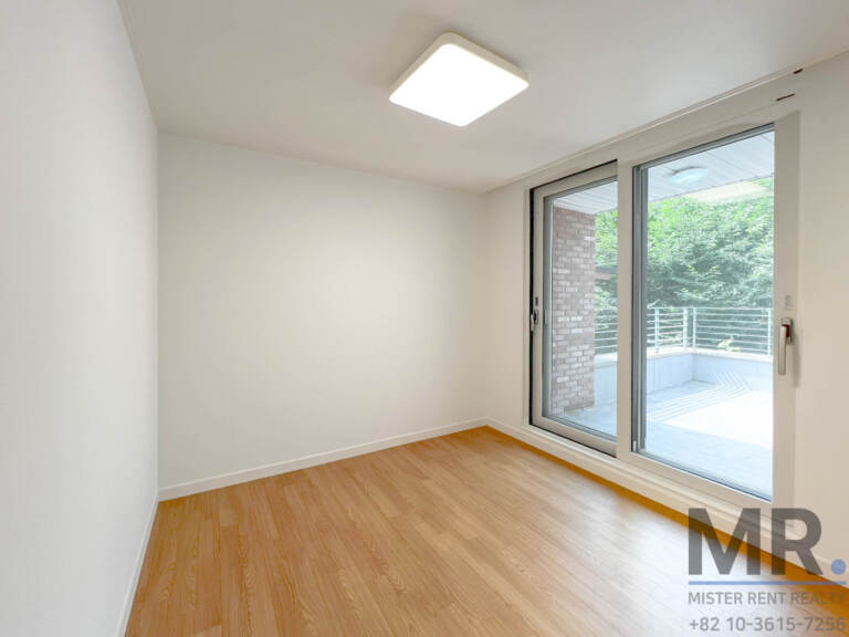 Bedroom with sliding doors to a private terrace
