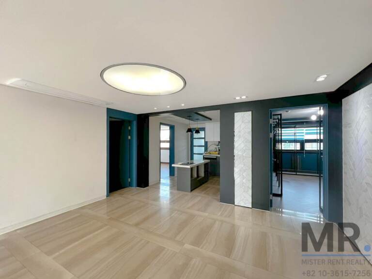 View from living room toward kitchen island and dining area