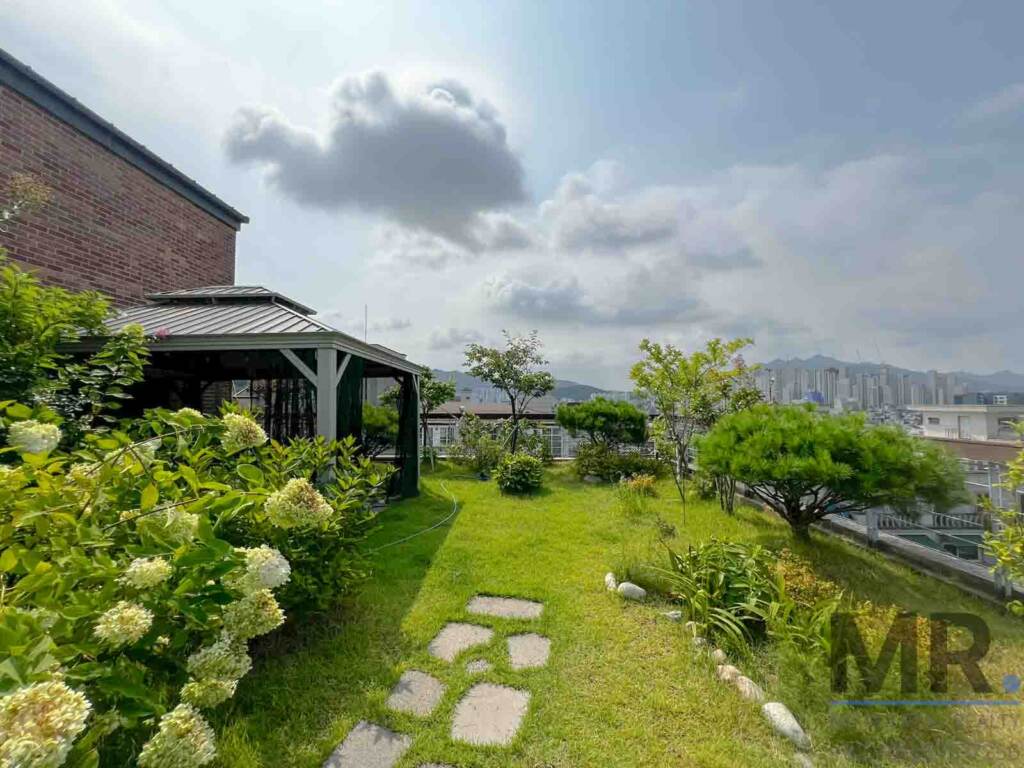 Rooftop garden with hydrangeas, stepping stones and gazebo