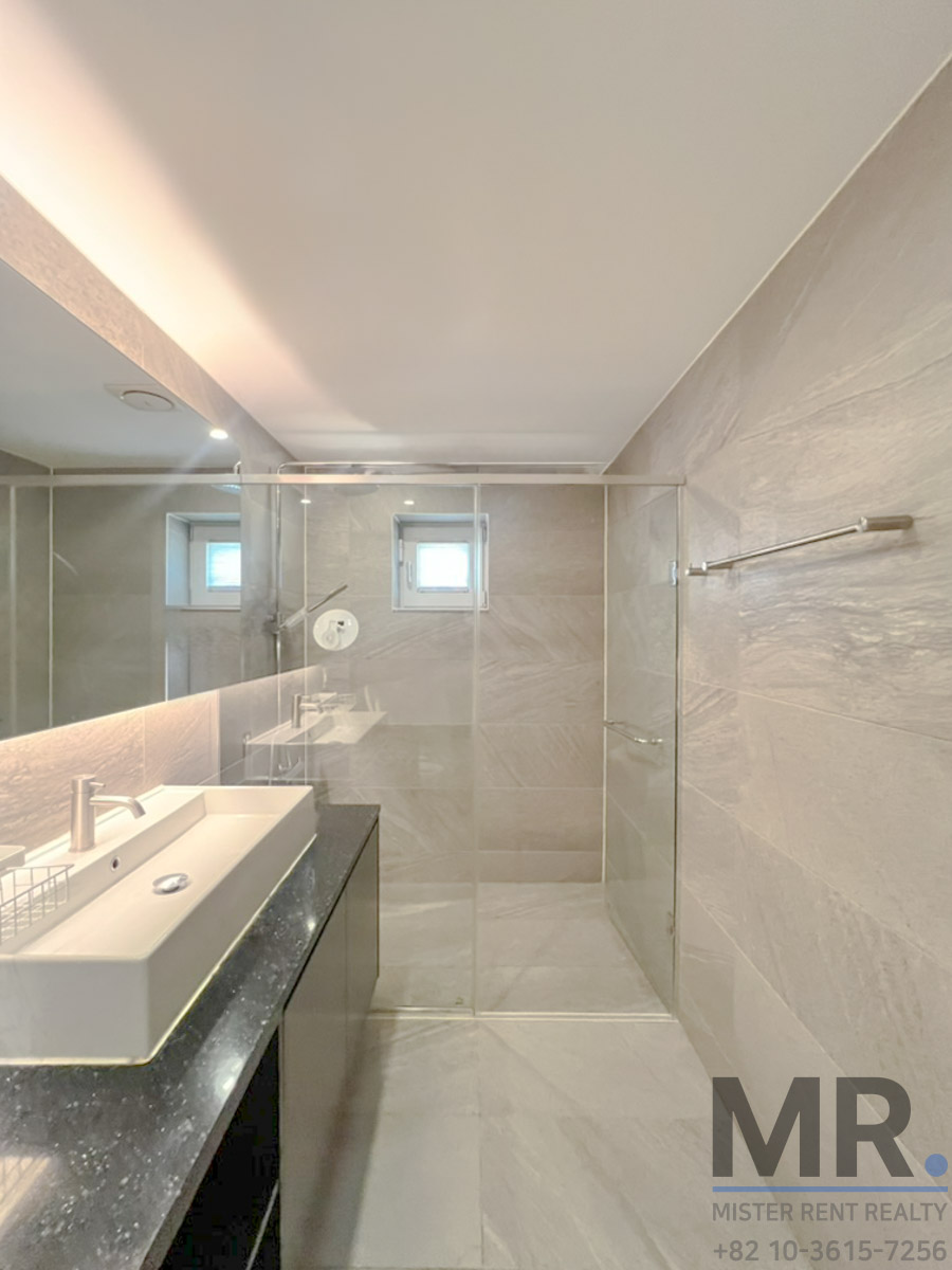 Sleek modern bathroom with glass shower
