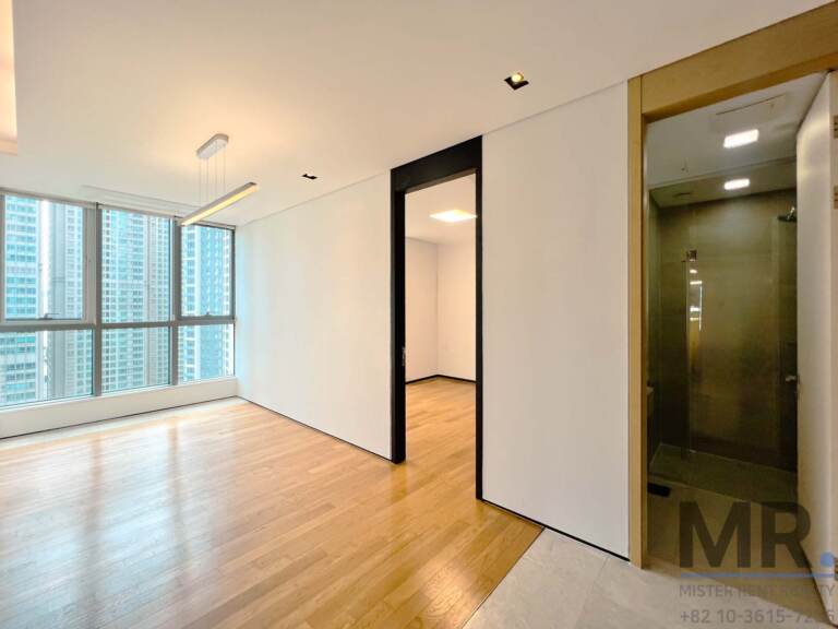 Bedroom with pendant light and en-suite glass shower