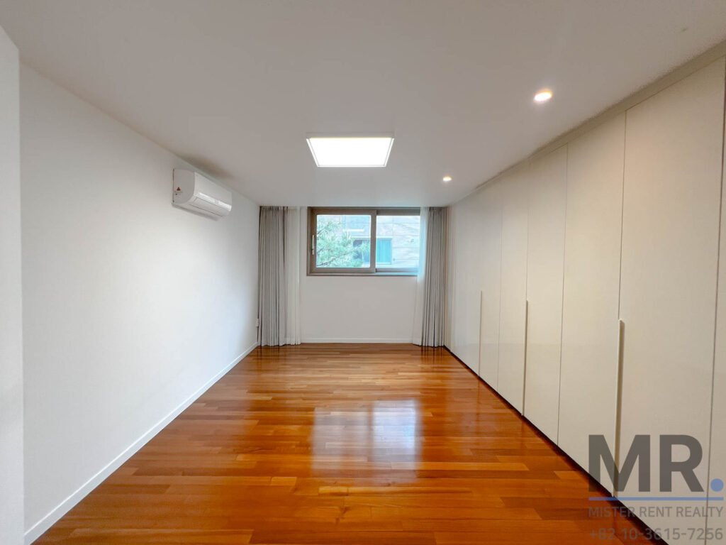 Empty room with wooden flooring