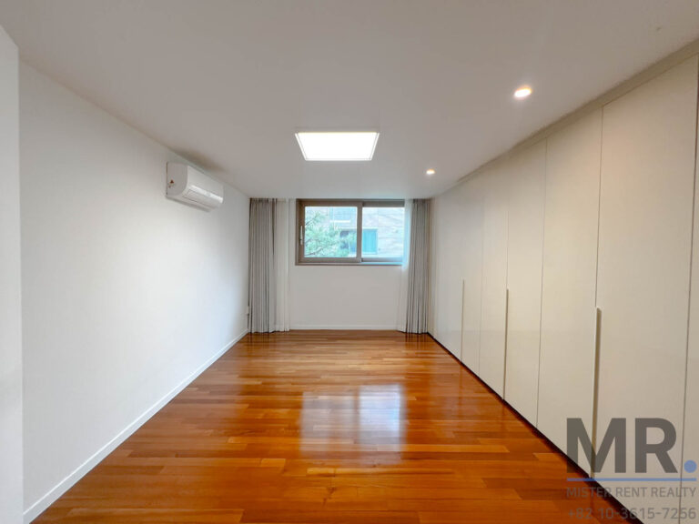 Empty room with wooden flooring