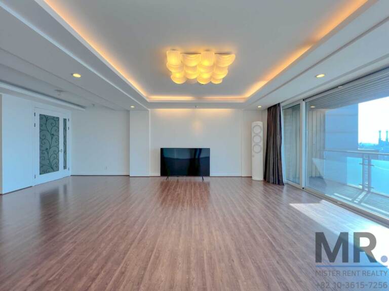 Living room with balcony doors, TV and cloud-shaped ceiling light