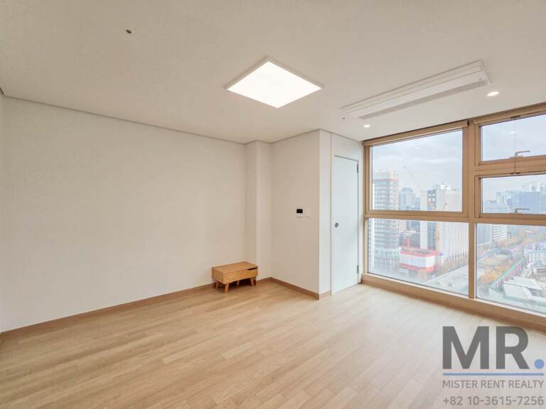 Master bedroom with corner windows and city view