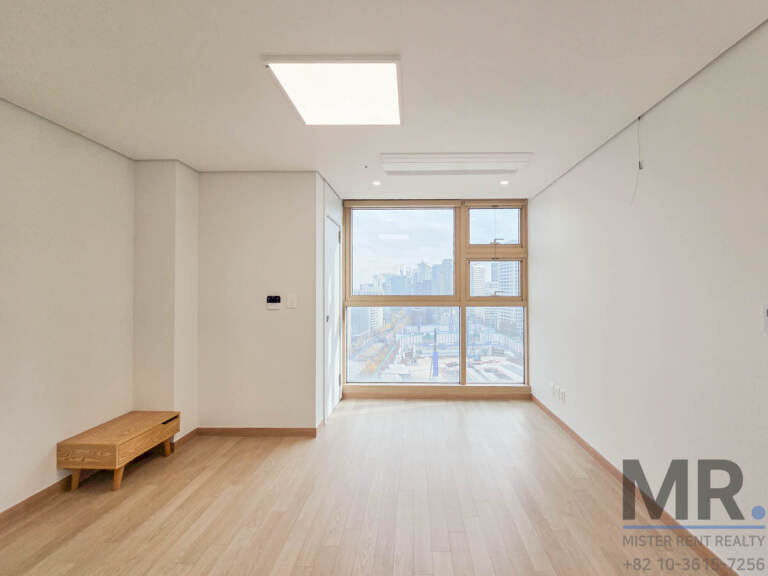 Bedroom with window, wooden bench and light oak floor